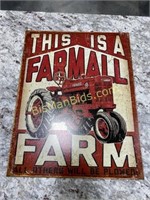 This is a Farmall Farm Metal Sign
