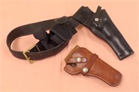(2) LEATHER HOLSTERS, ONE HAS BELT