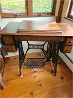 Antique singer tredle sewing machine cabinet