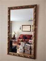 Ornate gold colored mirror