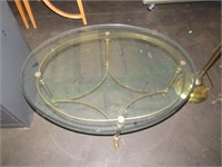 Oval glass/brass coffee table w/cloven hoof feet