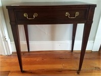 Mahogany single drawer writing table on tapered