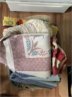 Tote of 10 unmatched rugs