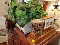 basket of ivy, candles, wood shelf