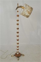 An antique Western Floor Lamp with horn lamp, feet