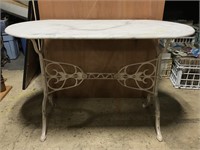 Marble table with cast iron base