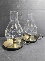 Pair of candlestick holders with glass shades