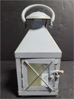 Small decorative lantern with faux candle