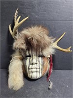 Tribal mask with fur and antlers