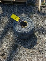 NEW ROLL OF BARBED WIRE