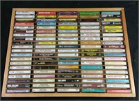 100 country cassettes in wooden storage shelf