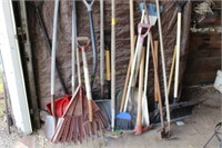 Assorted rakes, brooms, yard tools