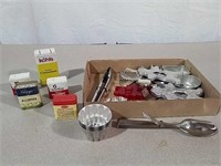 Cookie cutters and vintage spice tins