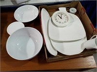 Various brands white plates, bowls and clock.