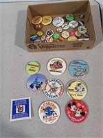 Various pin backs some are Disney, sayings and