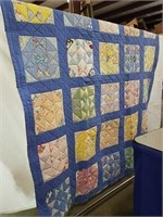 Vintage quilts primarily blue does show some wear