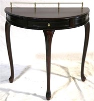 Small demilune table w/ brass gallery