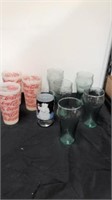 Group of glass and plastic coke glasses