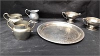Group of cream and sugars with serving tray