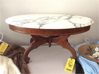 Oval marble toped table