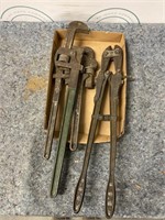 Pipe wrenches and bolt cutters