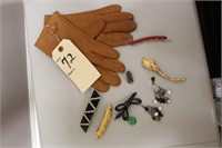 Leather gloves, jade pendants, brooch, and more