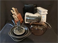 Various pans, Pyrex dish, toasters, and knife