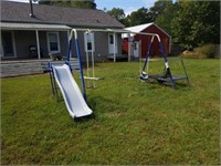 Child's play set with a broken trampoline