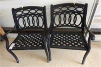 Lot #4859 - Pair of wrought iron open arm patio