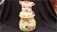 A bisque Pig in a Poke cookie jar marked  USA