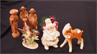 Six figurines: three carved wooden people,