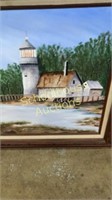 Framed lighthouse painting