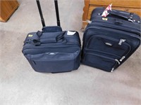 PAIR OF SOFT CASE SUITCASES ON WHEELS