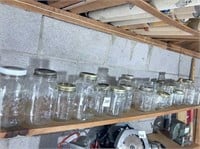 group of jars on top shelf