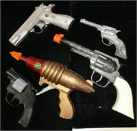 4 cap guns and a Razor friction trigger Ray Gun