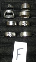 8 stainless steel rings. 7 being size 10.5-13 & 1
