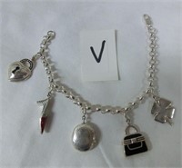sterling charm bracelet with 5 charms including