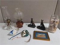 Box Lot: Oil Lamps, Book Ends, porcelain mask, ect