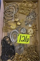 Flat of costume jewelry