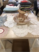 Pitcher and basin and assorted Doilies