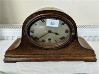 Oval faced mantle clock