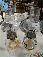 Two glass chamber oil lamps, 1 with reflector