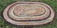 Hand braided oval rug, 93 " x 68"