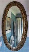 Oval gilt frame beveled edge mirror with pierced