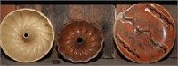 Yellow Ware and redware turk's head molds;