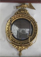 Early gilt mirror with sconces, carved plaster