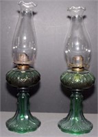 pair of green glass pedestal oil lights, 18" high