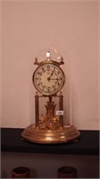 Brass anniversary clock with glass dome by