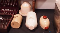 Four vintage stoneware items: three footwarmers
