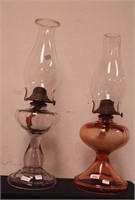 Two vintage oil lamps, one base is pink